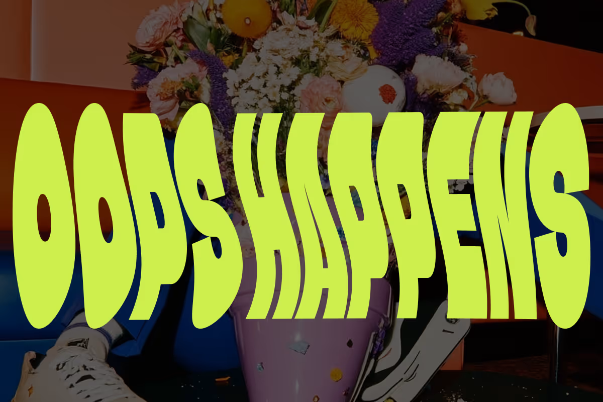 Bright green distorted text 'ODDS HAPPENS' over a bouquet of flowers and a person wearing white sneakers sitting on a blue chair.